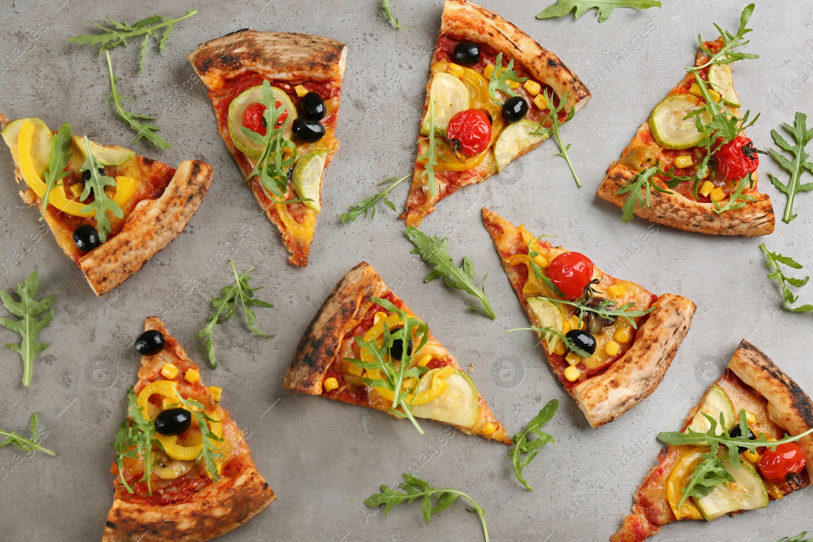 Photo of Flat lay composition with vegetable pizza on grey table