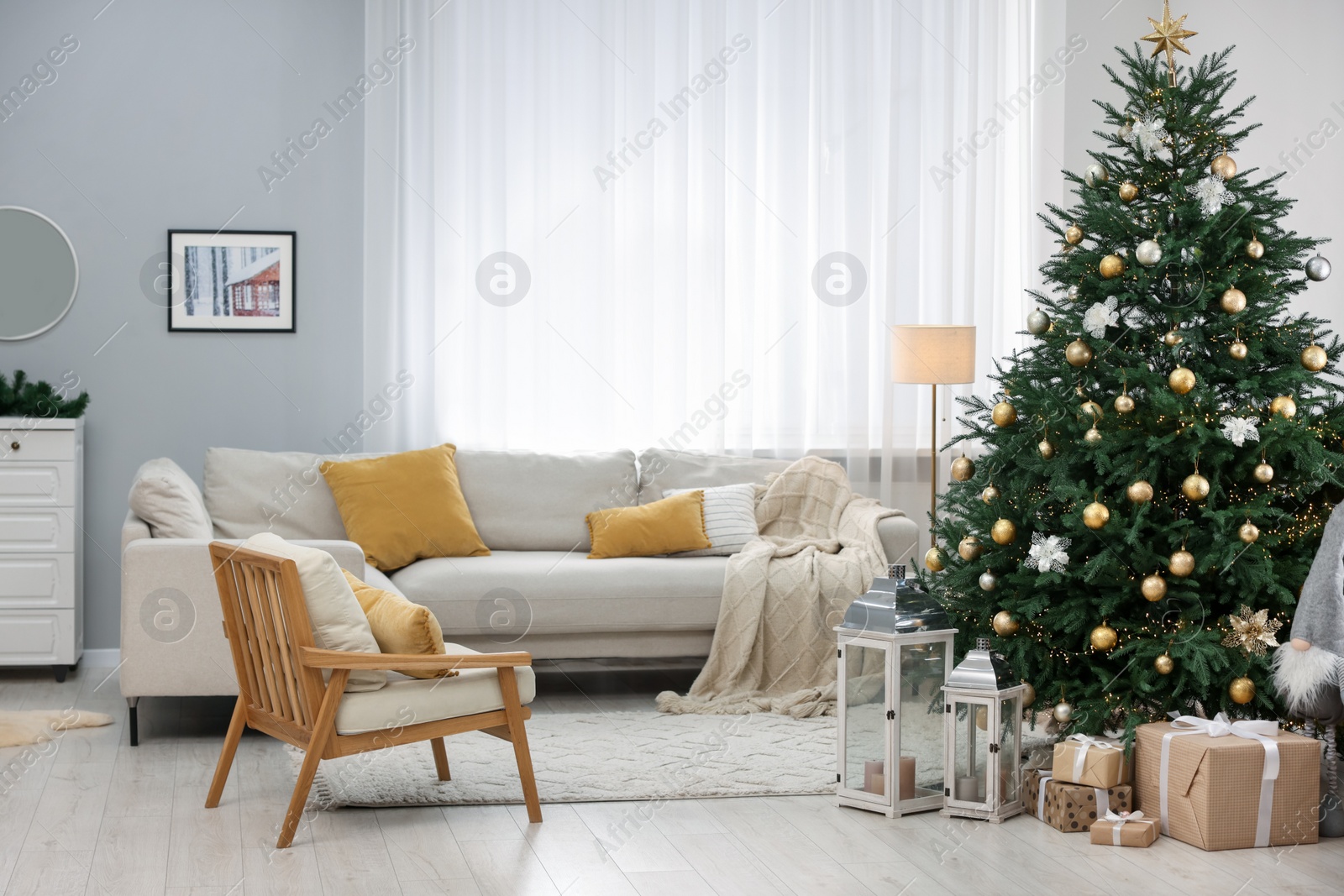 Photo of Christmas tree in furnished living room. Festive interior design