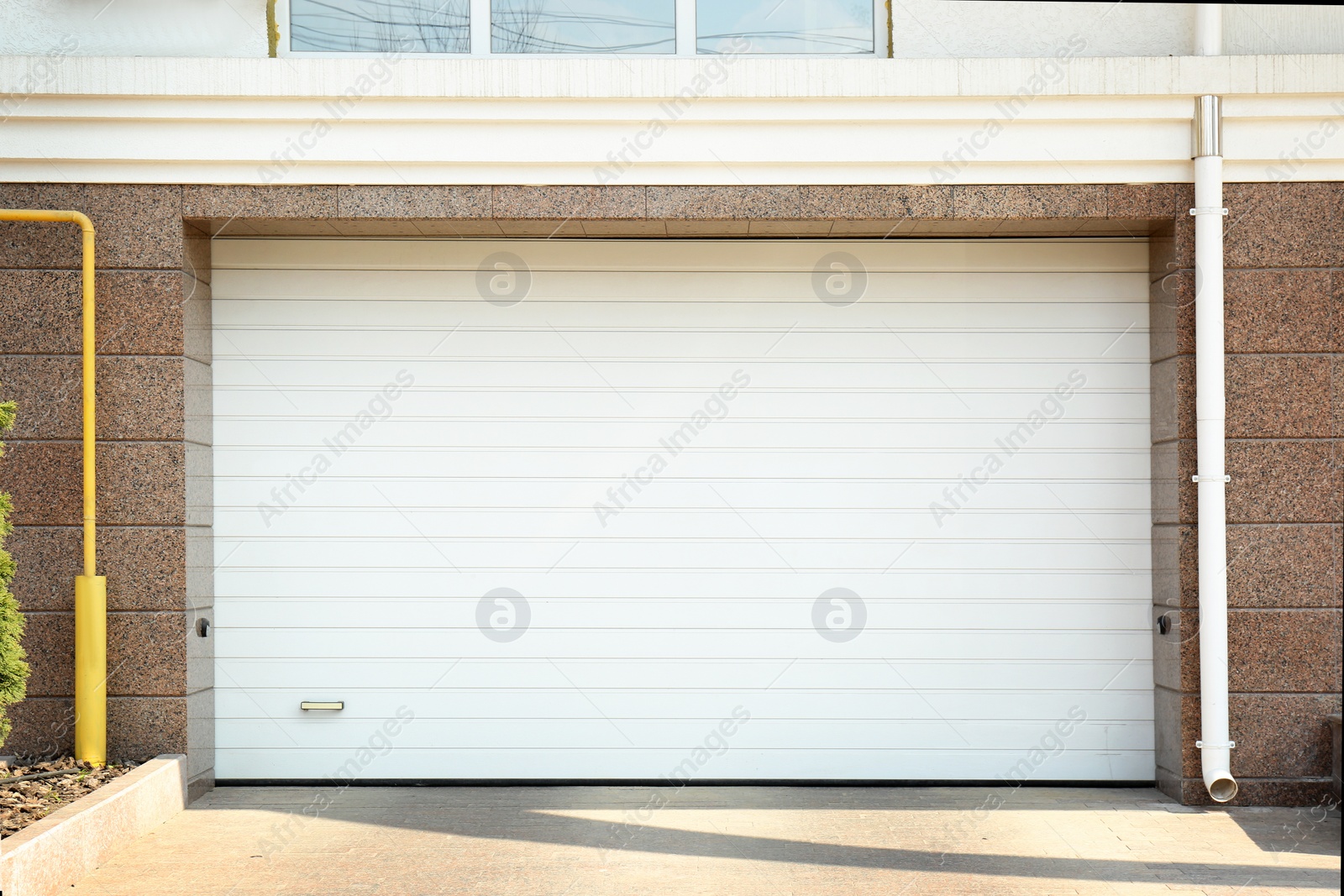 Photo of Closed roller shutter door of modern garage