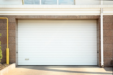 Closed roller shutter door of modern garage