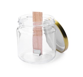 Photo of Glass jar with wooden wick and lid on white background. Making homemade candle