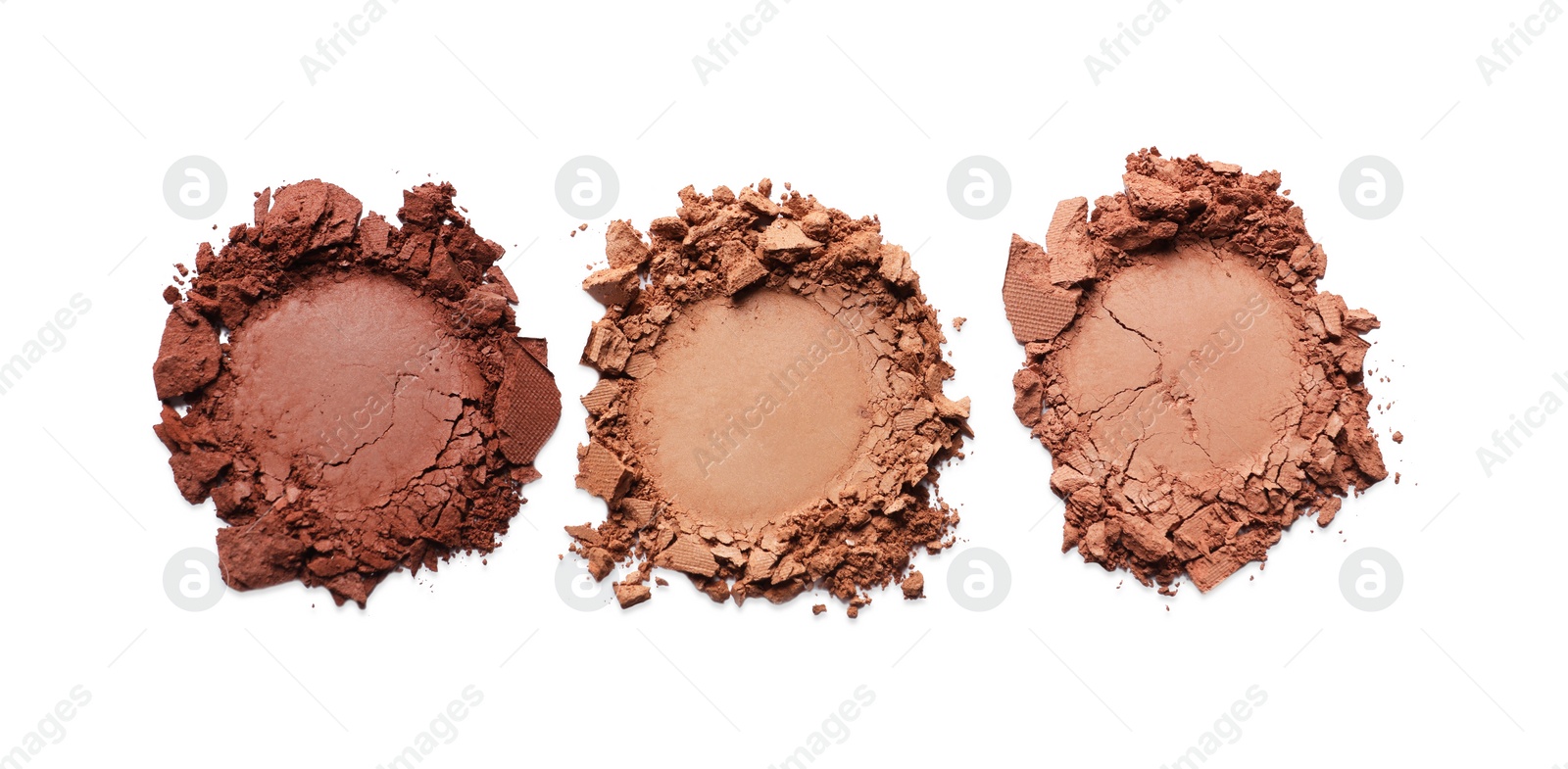 Photo of Different crushed eye shadows on white background, top view