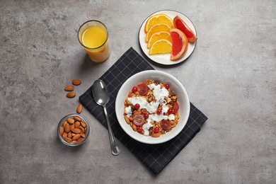 Tasty healthy breakfast served on grey table, flat lay