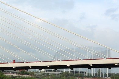 Beautiful view of modern bridge against cloudy sky