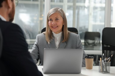 Lawyer working with client at table in office