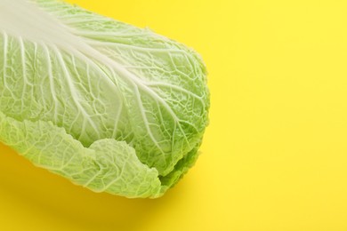 Fresh ripe Chinese cabbage on yellow background, space for text