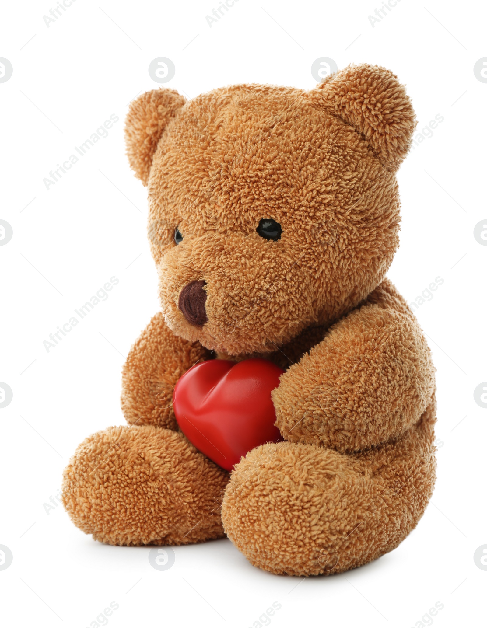 Photo of Cute teddy bear with red heart isolated on white. Valentine's day celebration