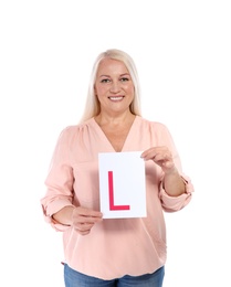 Happy mature woman with L-plate on white background. Getting driving license