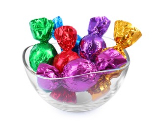 Photo of Bowl with many tasty candies in colorful wrappers on white background