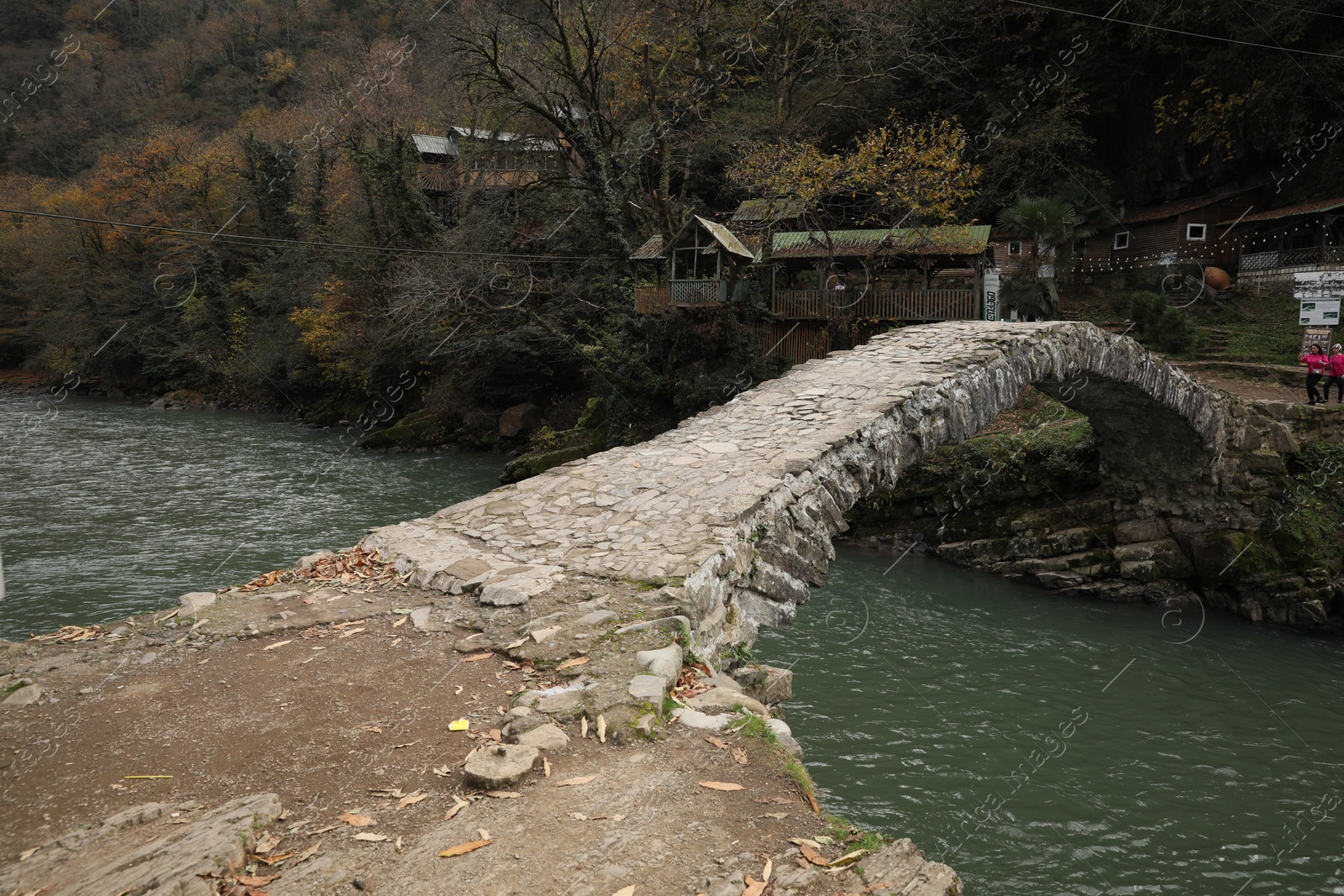 Photo of Adjara, Georgia - November 19, 2022: Picturesque view of stone arched bridge over Acharistskali river