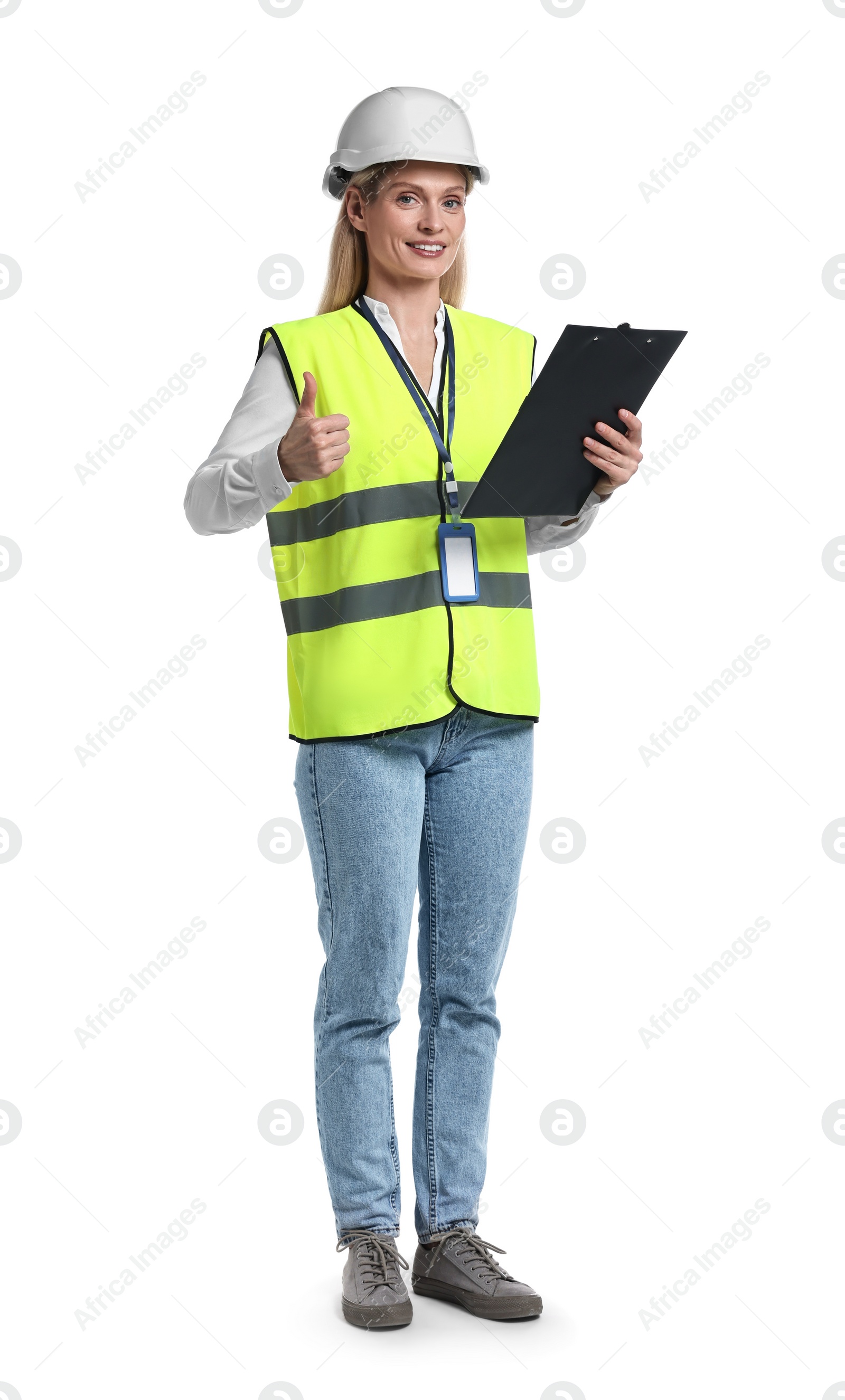 Photo of Engineer in hard hat holding clipboard and showing thumb up on white background