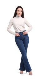 Young woman in stylish jeans on white background