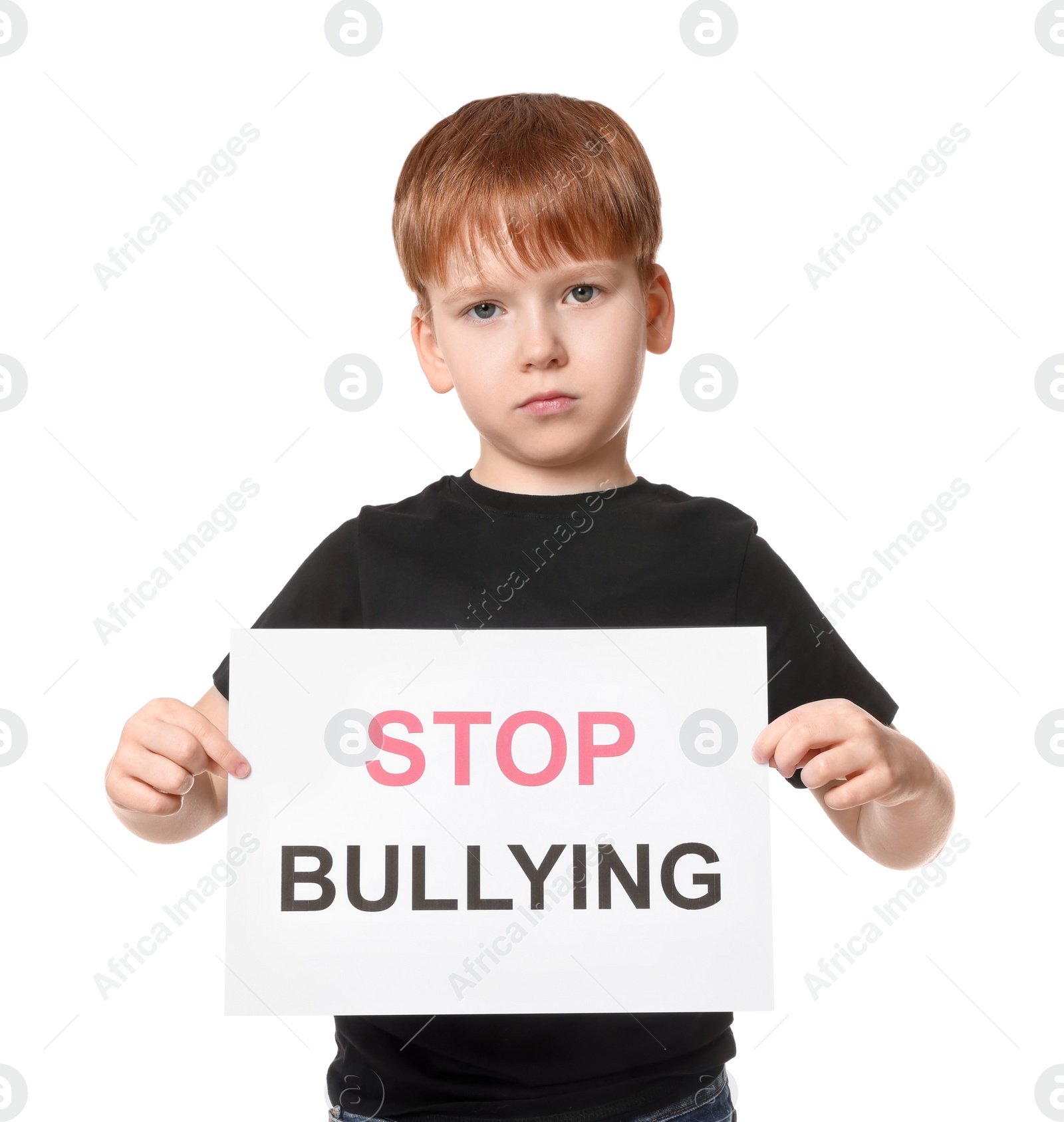 Photo of Boy holding sign with phrase Stop Bullying on white background