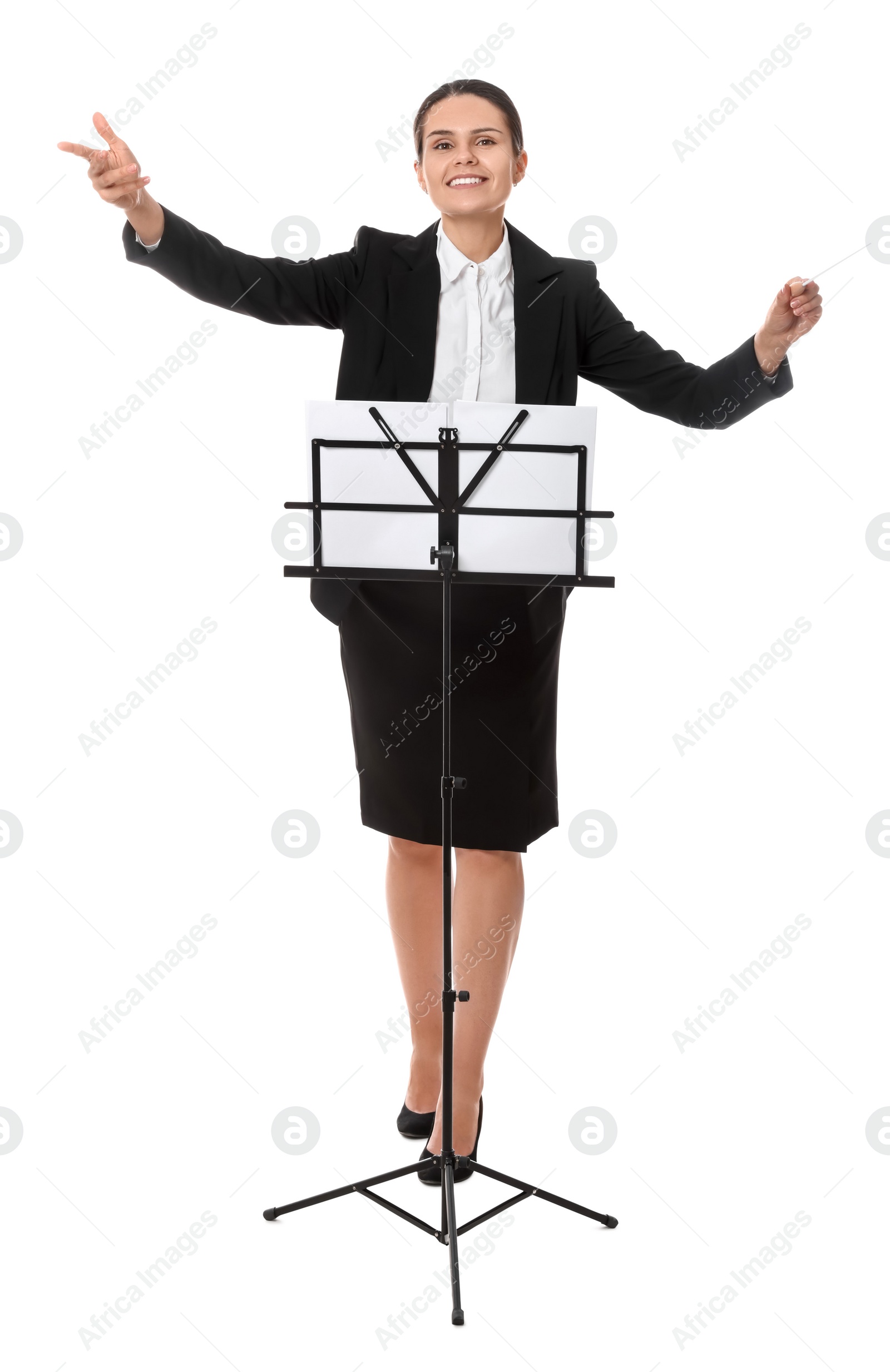 Photo of Happy young conductor with baton and note stand on white background