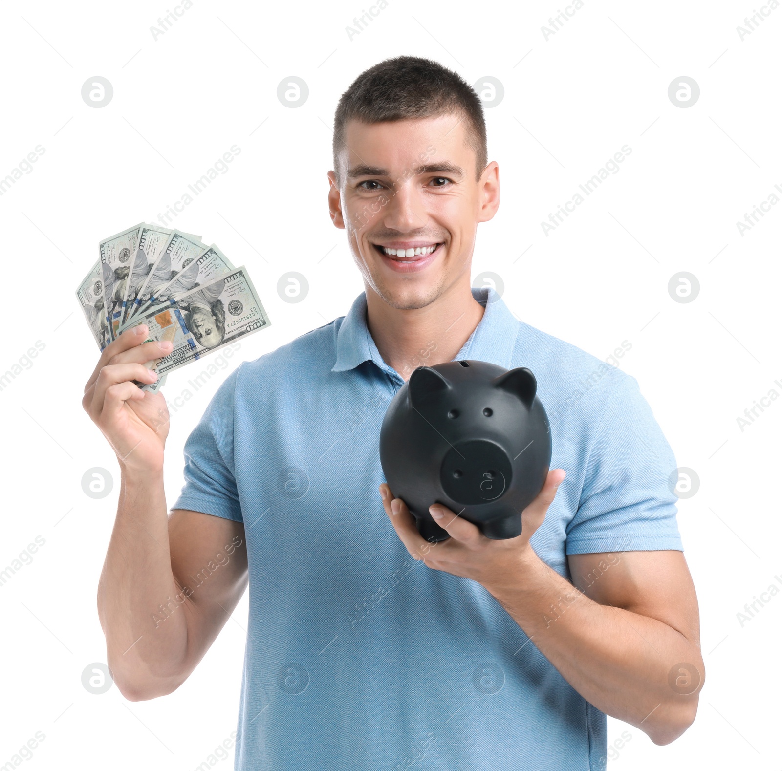 Photo of Handsome young man with dollars and piggy bank on white background