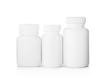 Photo of Blank plastic bottles for pills isolated on white