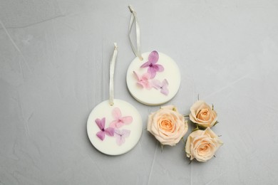 Photo of Flat lay composition with scented sachets on light grey table