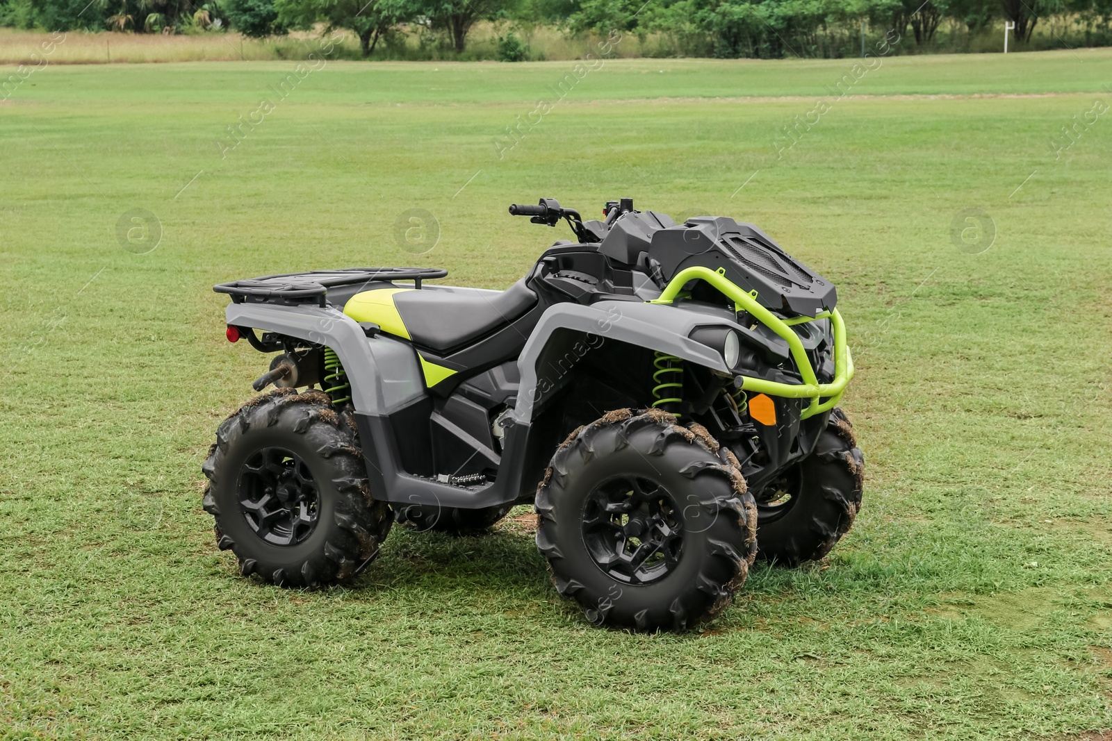 Photo of Modern quad bike on green grass outdoors