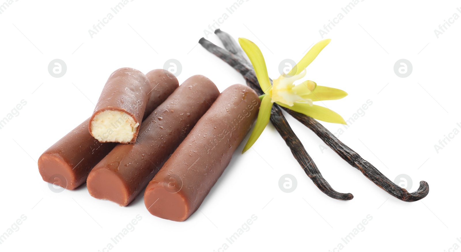 Photo of Glazed curd cheese bars, vanilla pods and flower isolated on white