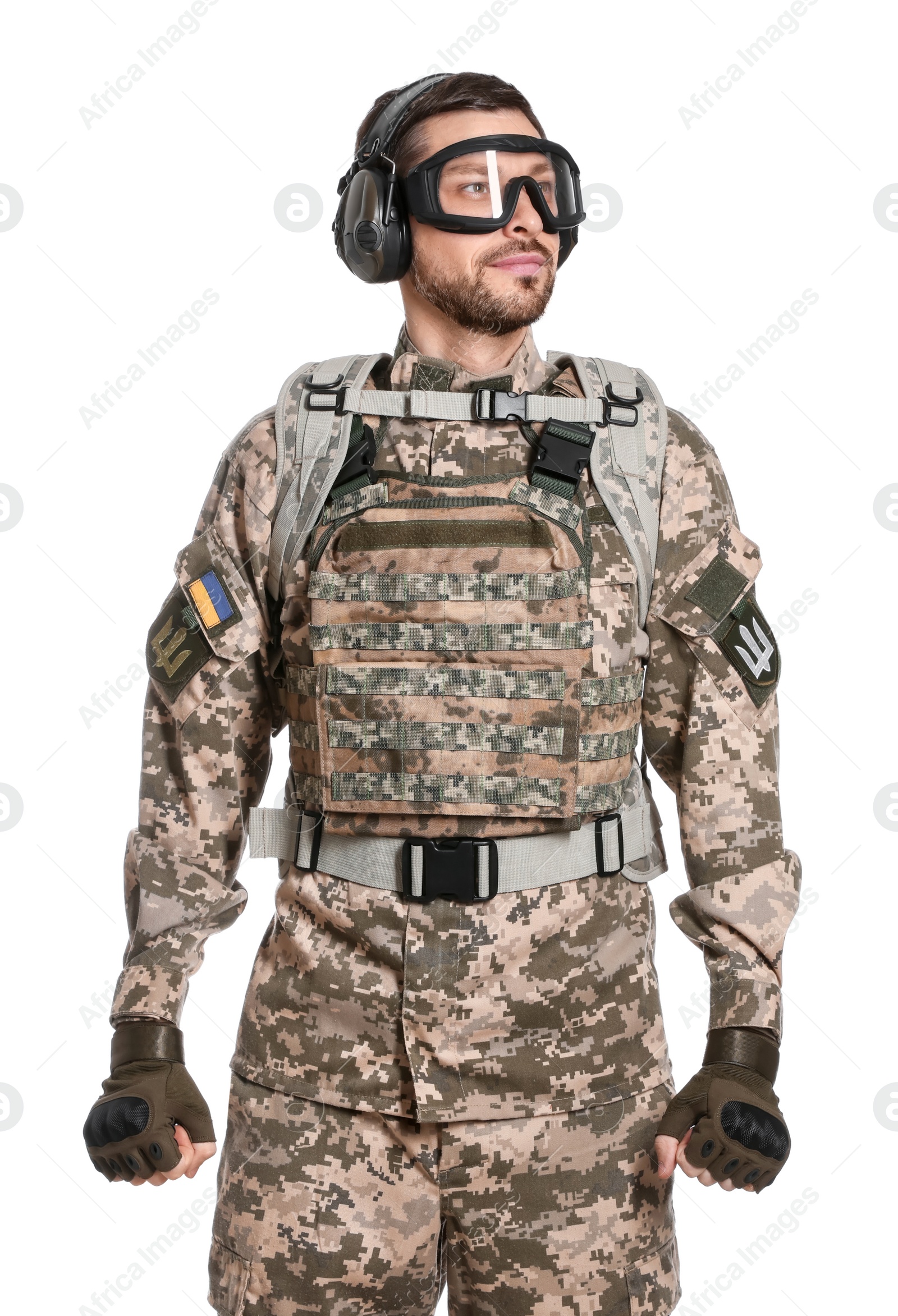 Photo of Soldier in Ukrainian military uniform, tactical goggles and headphones on white background