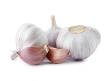 Fresh garlic bulbs and cloves on white background