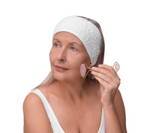 Photo of Woman massaging her face with rose quartz roller isolated on white