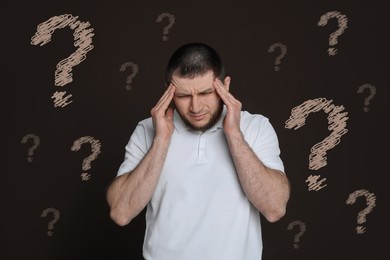 Image of Amnesia. Confused man and question marks on brown background