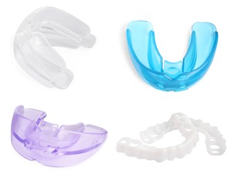 Image of Set with different mouth guards on white background. Bite correction treatment