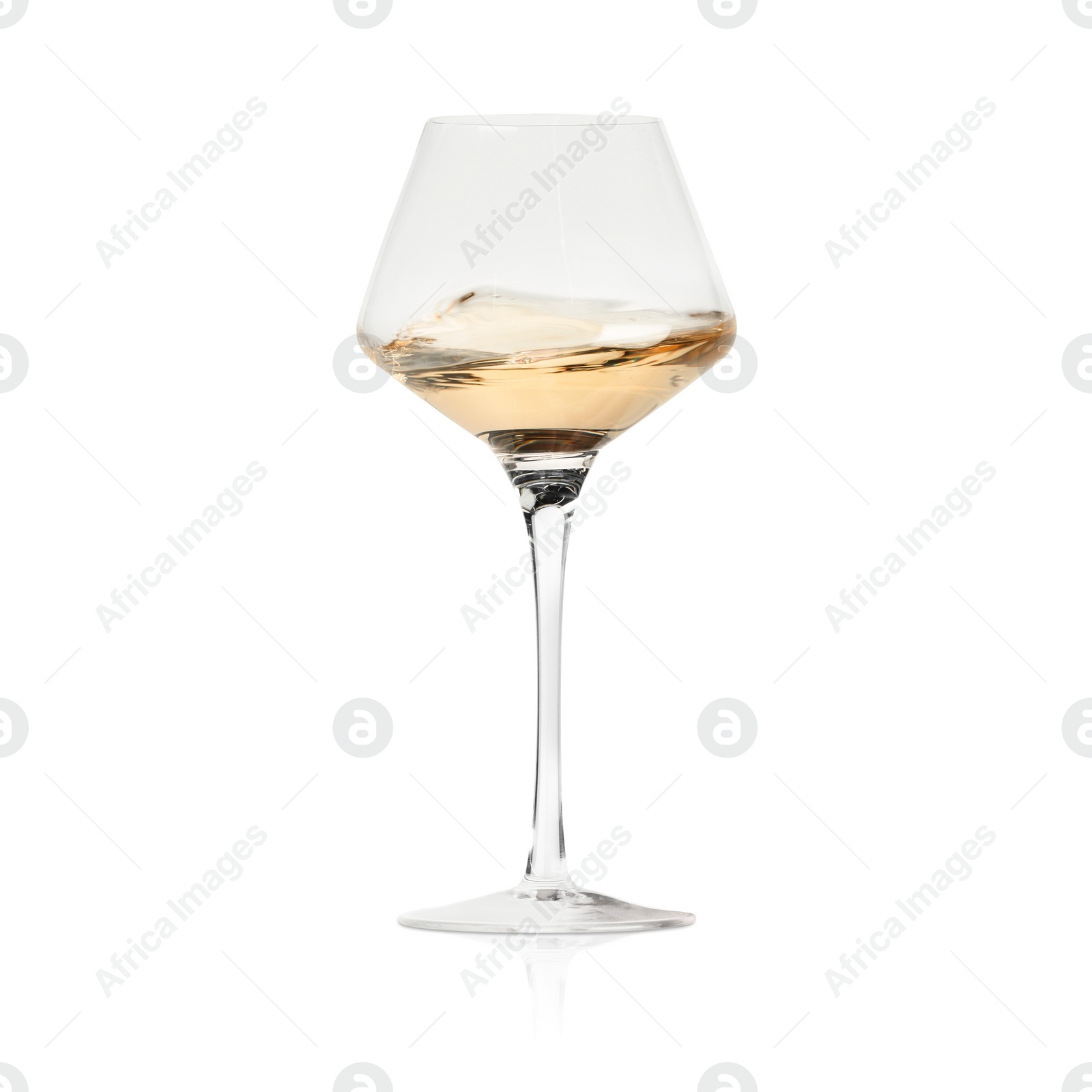 Image of White wine splashing in glass on white background