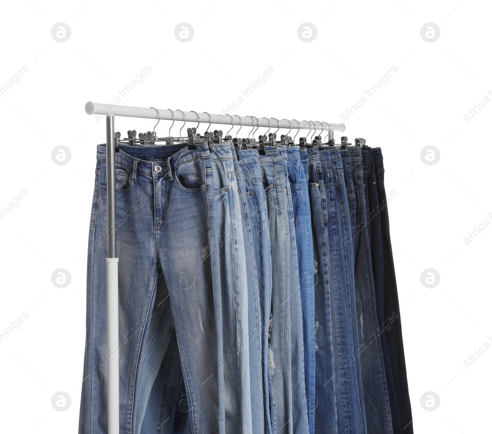 Photo of Rack with different jeans isolated on white