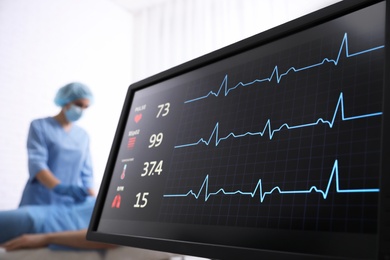 Cardiogram and data on display of heart rate monitor in clinic