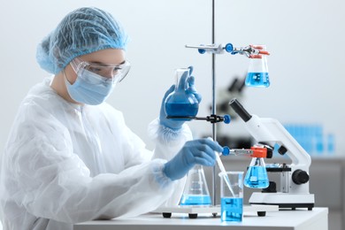 Photo of Young scientist working with samples in laboratory