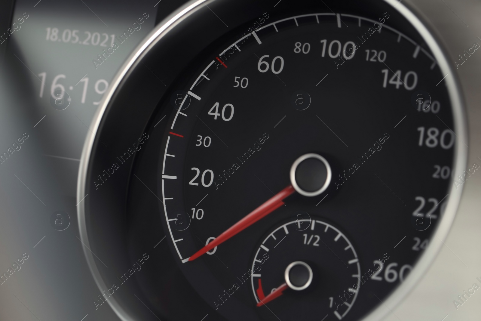 Photo of Speedometer on modern car dashboard, closeup view