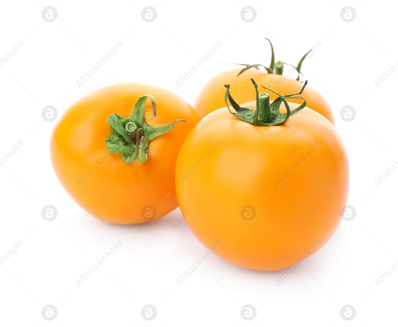 Photo of Delicious ripe orange tomatoes on white background