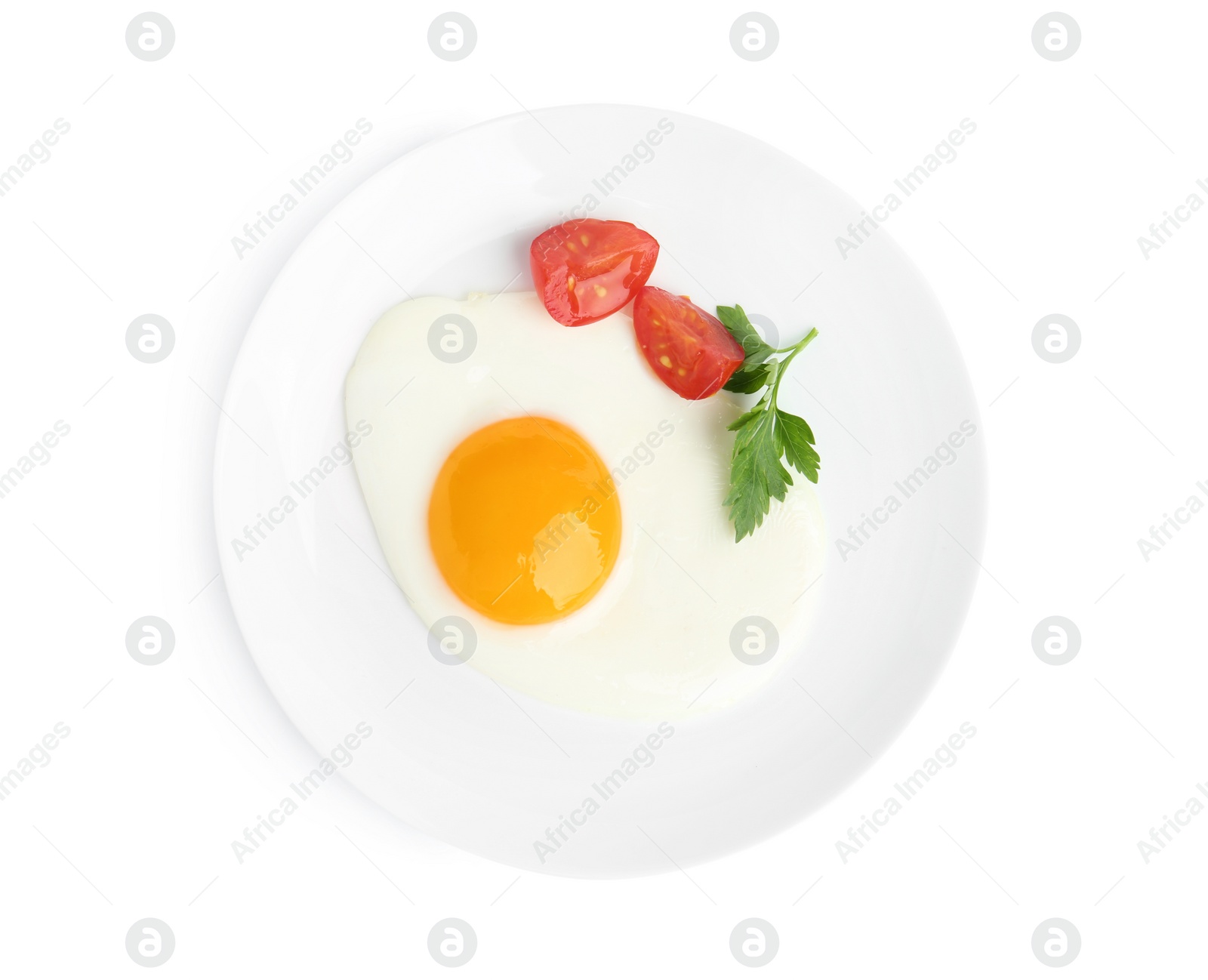 Photo of Tasty fried egg with parsley and tomato isolated on white, top view