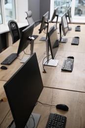 Photo of Many modern computers in open space office