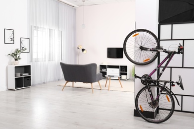 Photo of Light living room interior with modern bicycle