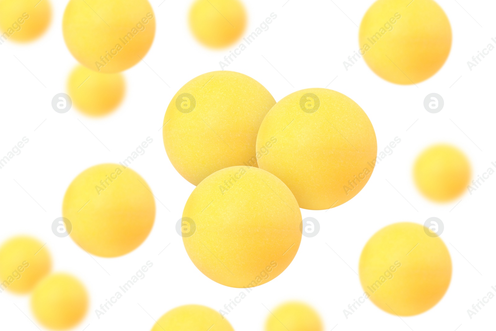 Image of Many table tennis balls flying on white background