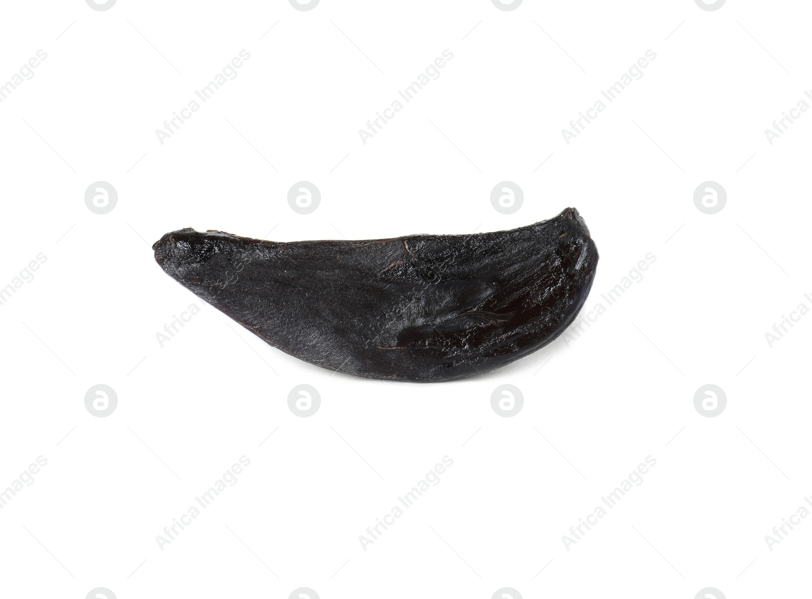 Photo of Clove of aged black garlic on white background