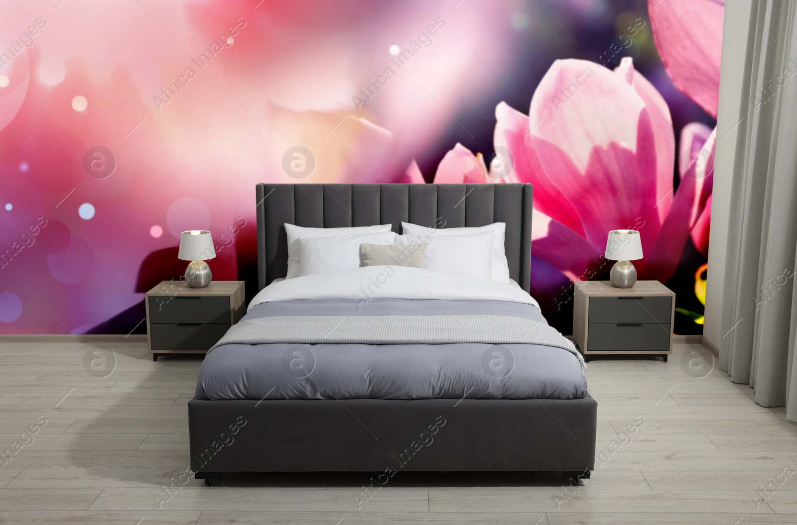 Image of Stylish bedroom interior with furniture and beautiful floral wallpapers