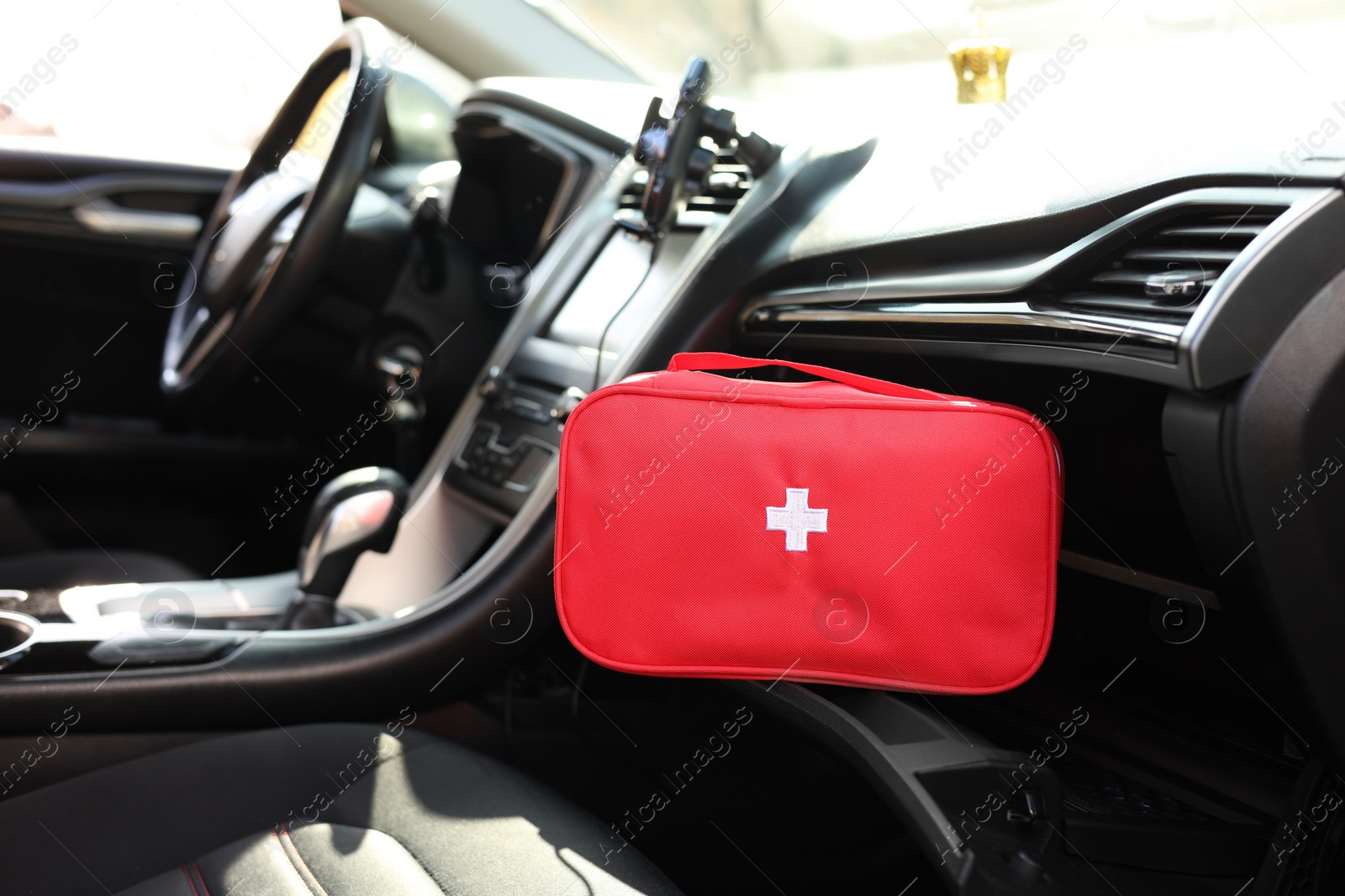 Photo of First aid kit with medicaments inside car