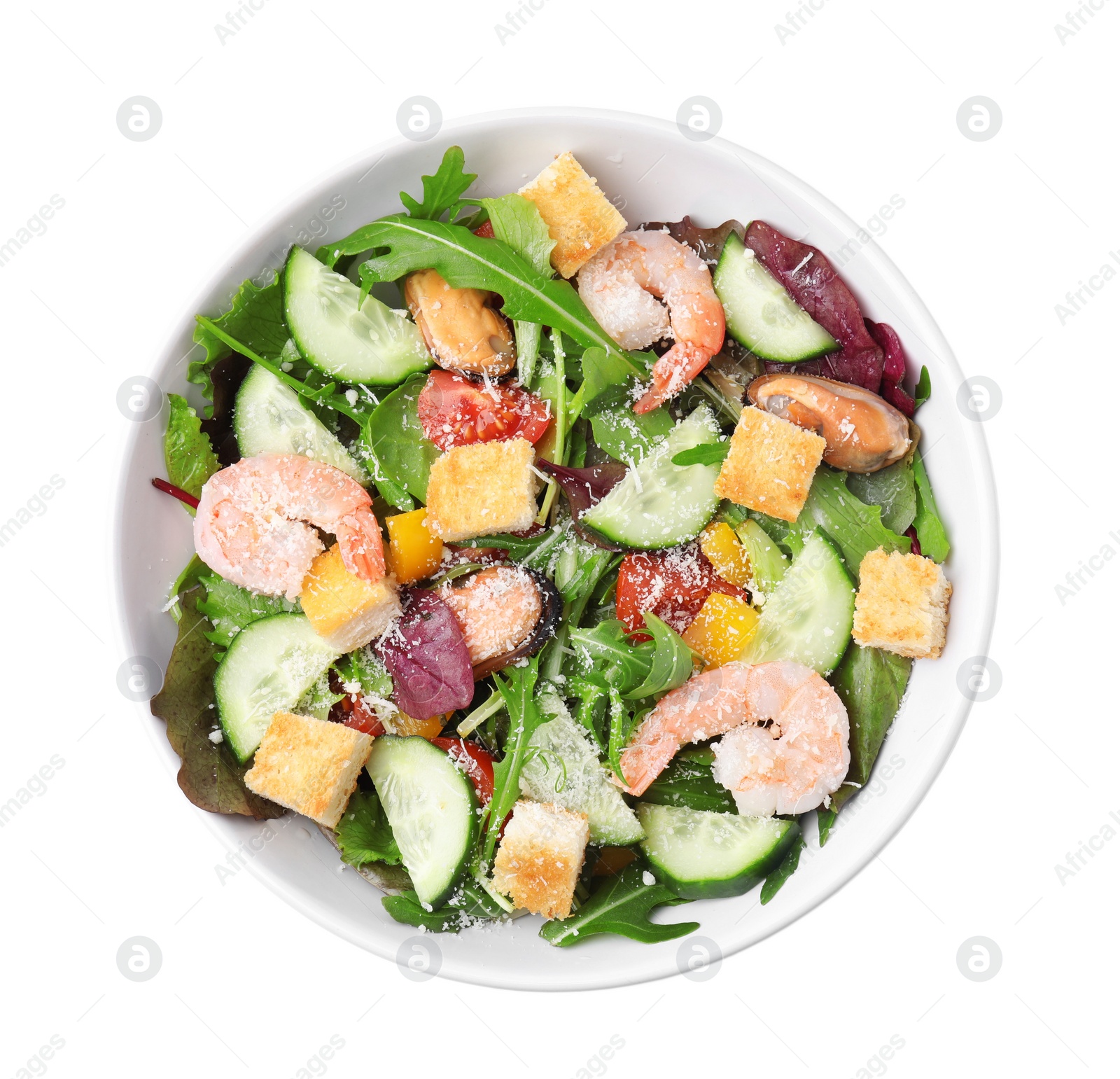 Photo of Delicious salad with croutons, cucumber and shrimp isolated on white, top view