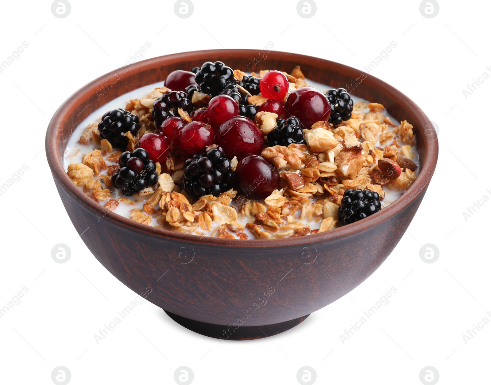 Photo of Bowl of healthy muesli with milk and berries isolated on white