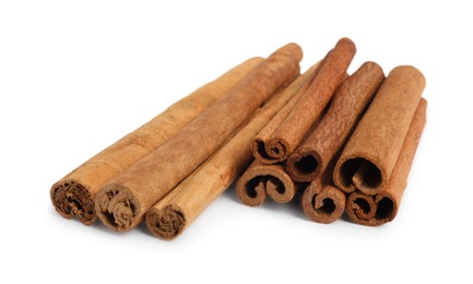 Photo of Dry aromatic cinnamon sticks isolated on white