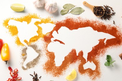 Photo of World map of different spices and products on white textured table, flat lay