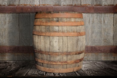 Image of One wooden barrel on surface near textured wall