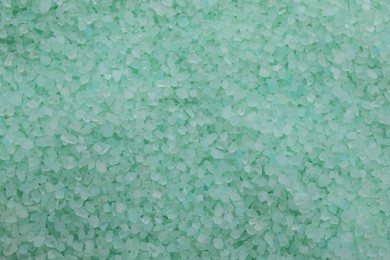 Photo of Turquoise sea salt as background, top view