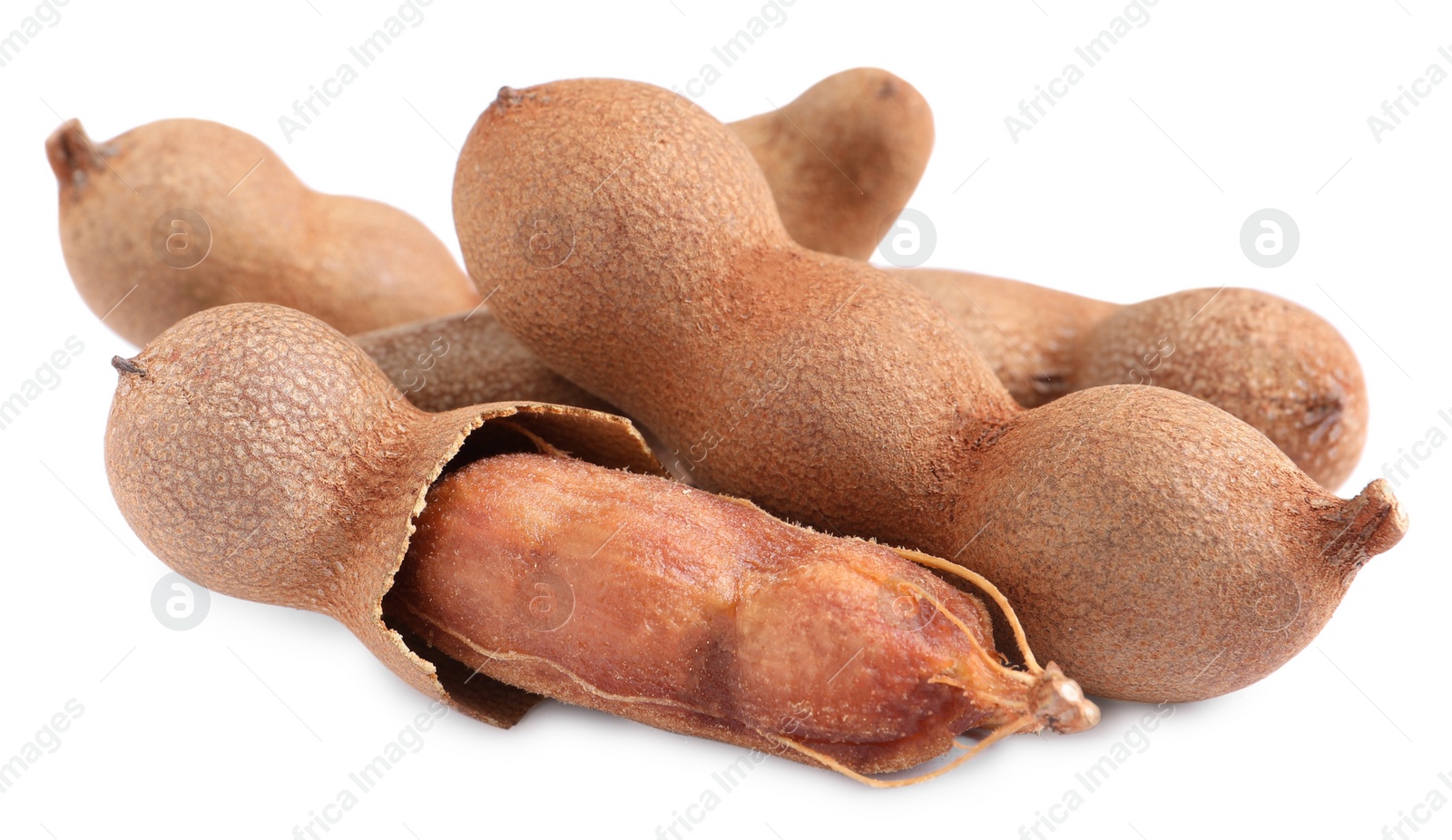 Photo of Delicious ripe tamarinds on white background. Exotic fruit