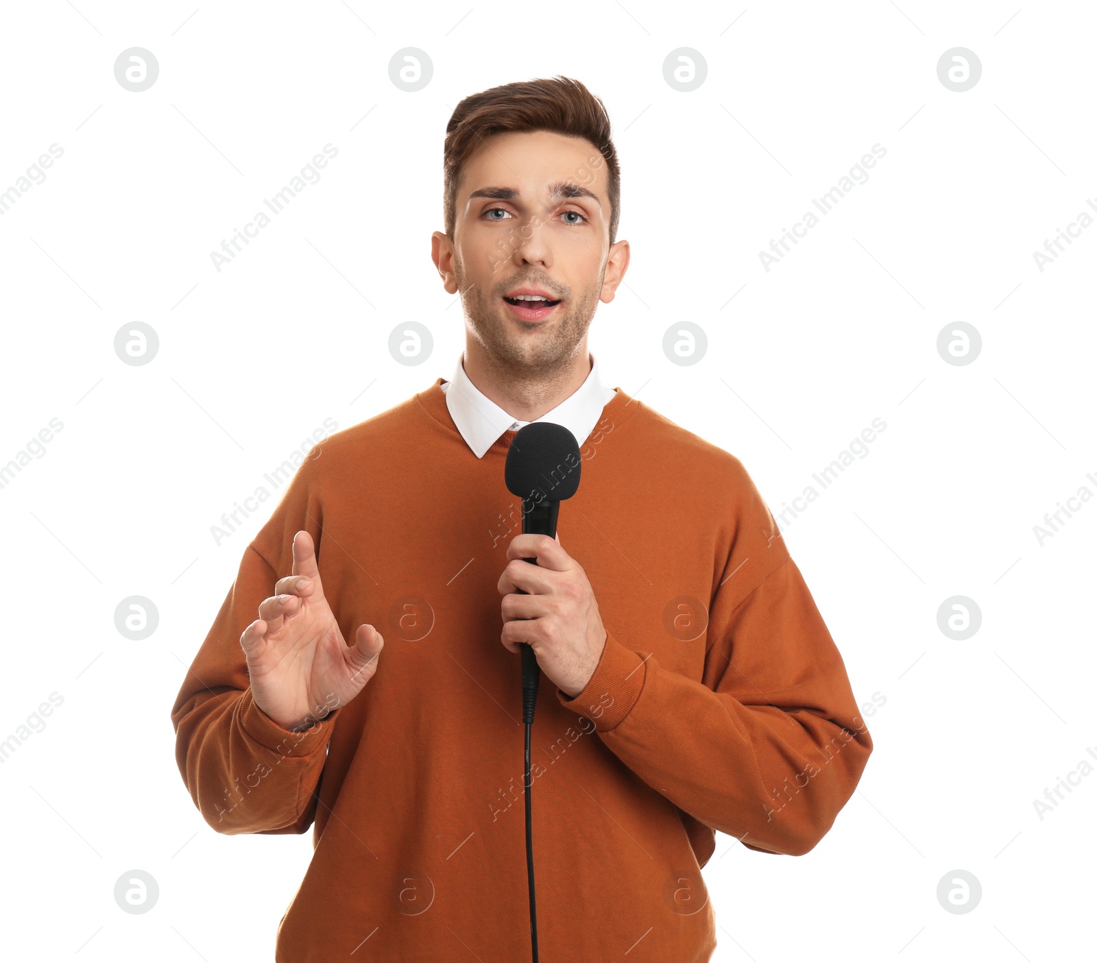 Photo of Young male journalist with microphone on white background