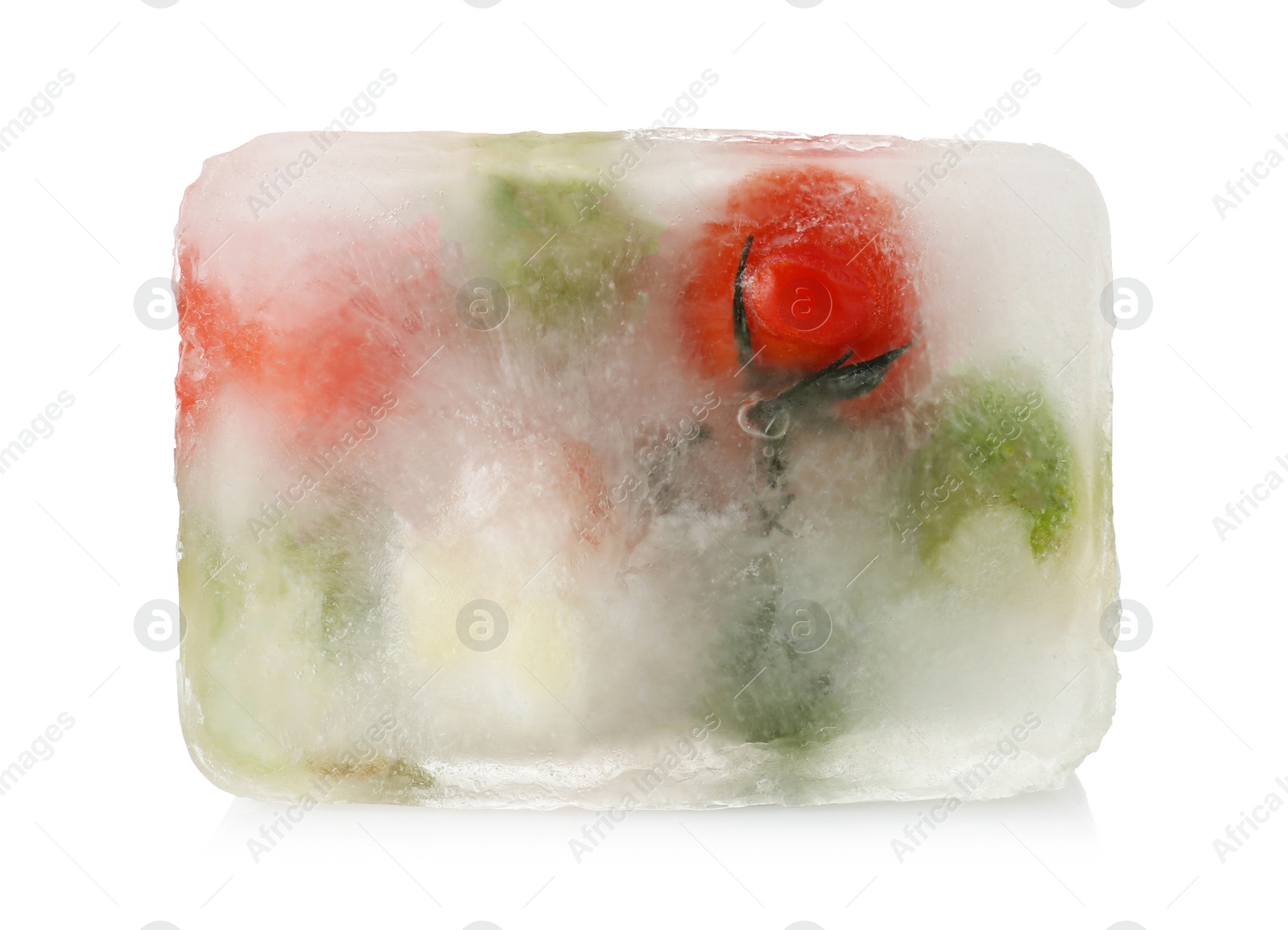 Photo of Fresh vegetables frozen in ice cube on white background